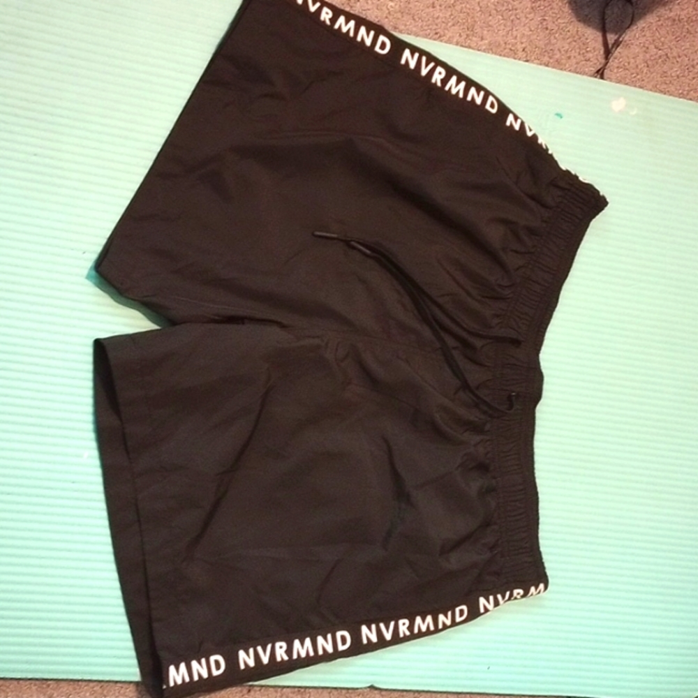 Men swim shorts from h&m. They're all black that say "nvrmnd" along both sides.